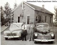 The building in the photo is now called the "Little Red Schoolhouse." It is located on Wells Road west of the intersection with Wolcott Hill Road.